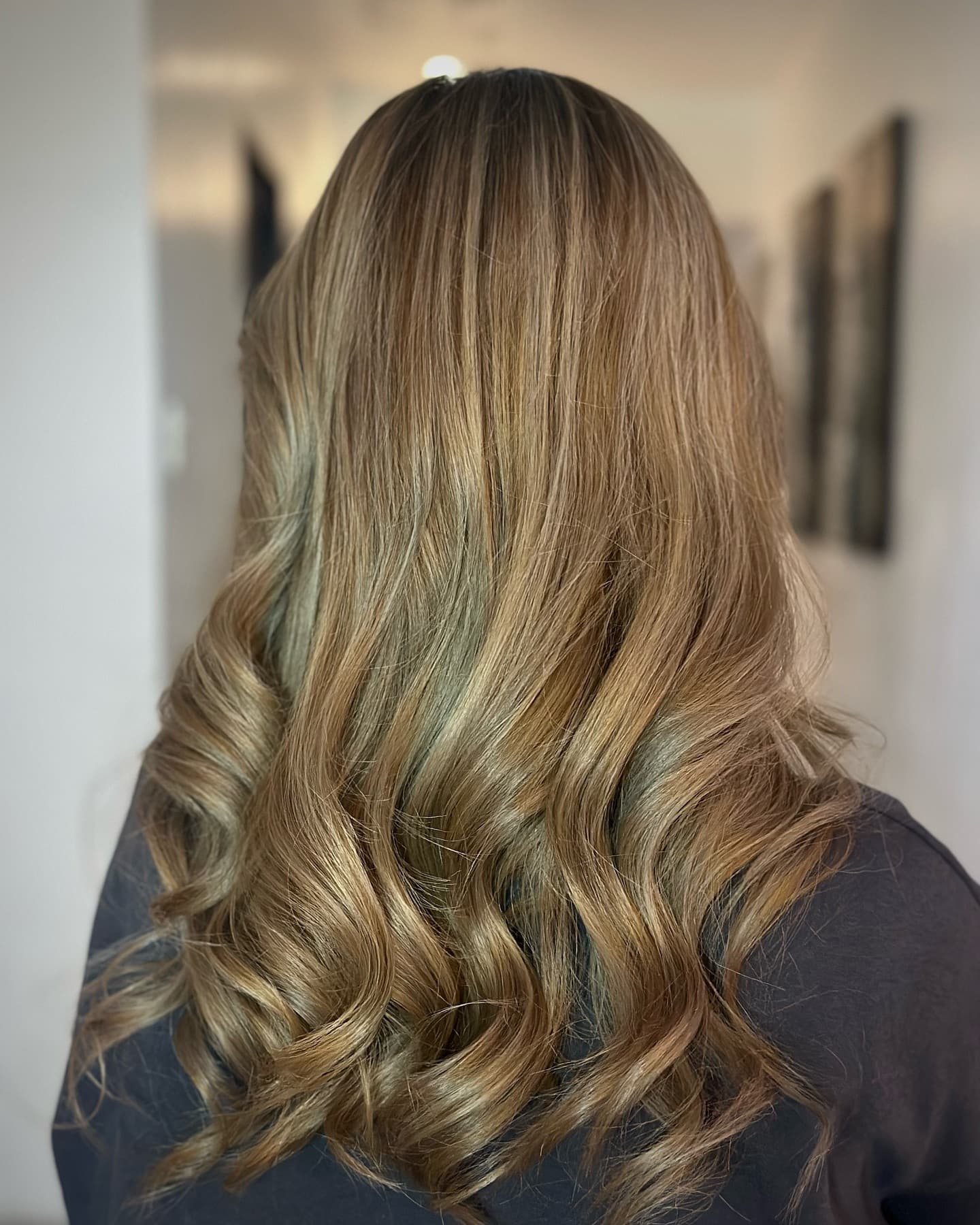 Blonde balayage loose curls by Eclisse Beauty Lounge