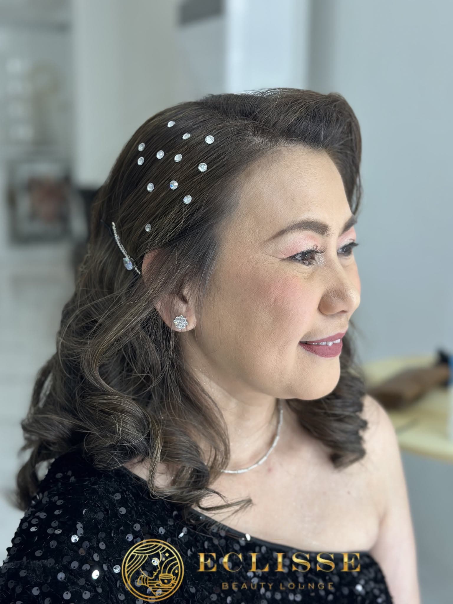 Soft glam makeup with sparkle hair accents and waves by Eclisse Beauty Lounge